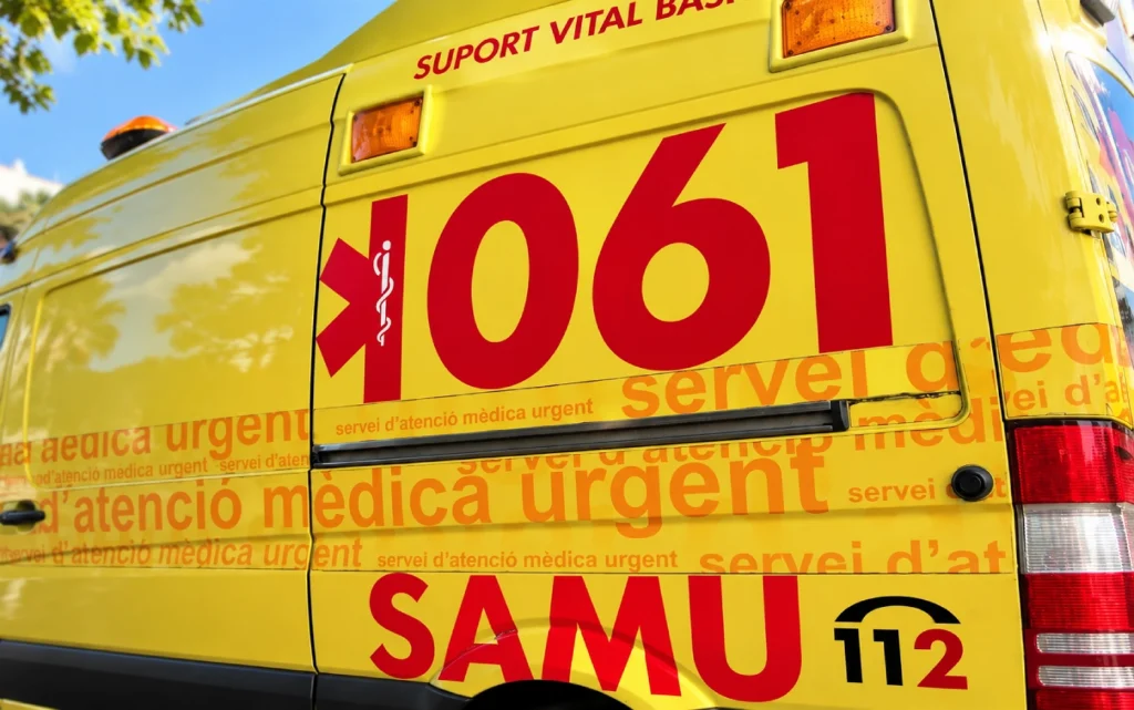 Detail of a yellow SAMU 061 ambulance with emergency service markings and the 112 number in Ibiza